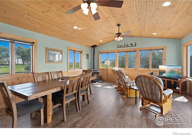 32924 County Road 29, Greeley, CO 80631 - dining area featuring a wood stove, vaulted ceiling, wooden ceiling, ceiling fan, and wood finished floors