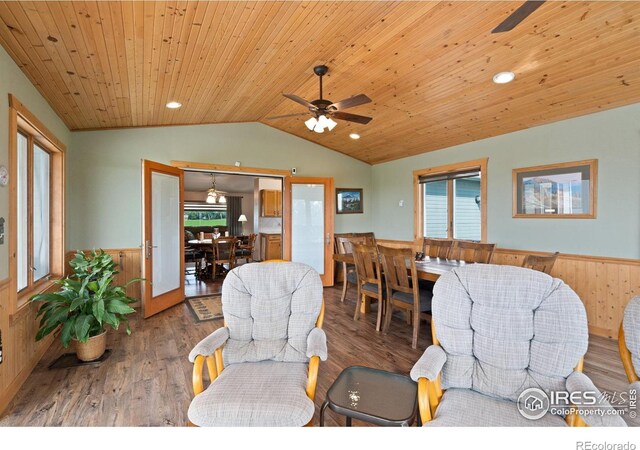 32924 County Road 29, Greeley, CO 80631 - living room featuring wainscoting, vaulted ceiling, wood finished floors, wooden ceiling, and ceiling fan