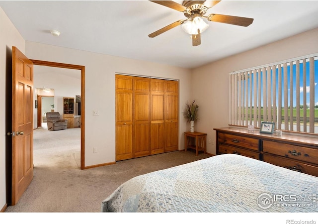 32924 County Road 29, Greeley, CO 80631 - bedroom featuring light colored carpet, a closet, a ceiling fan, and baseboards