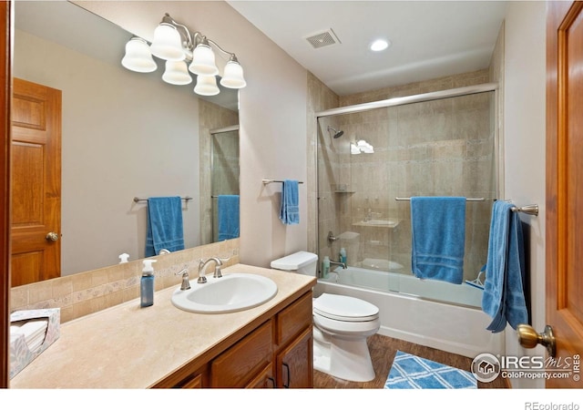 32924 County Road 29, Greeley, CO 80631 - full bath featuring vanity, toilet, and bath / shower combo with glass door