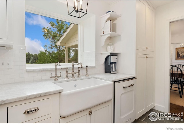 7215 Hygiene Rd, Longmont, CO 80503 - kitchen with a sink, open shelves, backsplash, and white cabinets