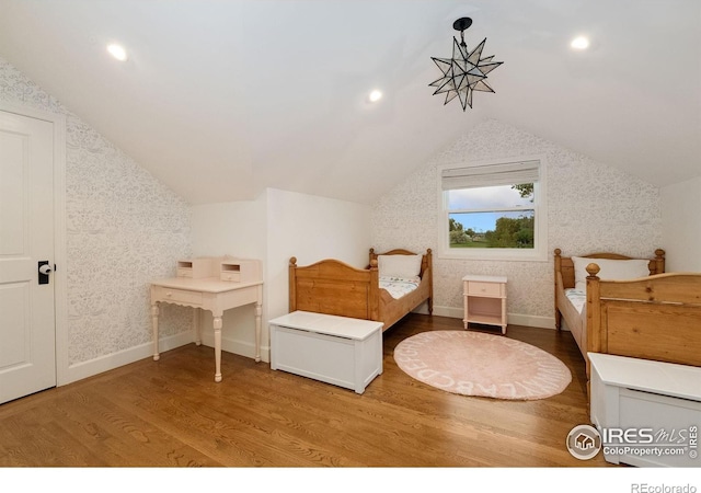 7215 Hygiene Rd, Longmont, CO 80503 - bedroom featuring wallpapered walls, vaulted ceiling, wood finished floors, baseboards, and recessed lighting