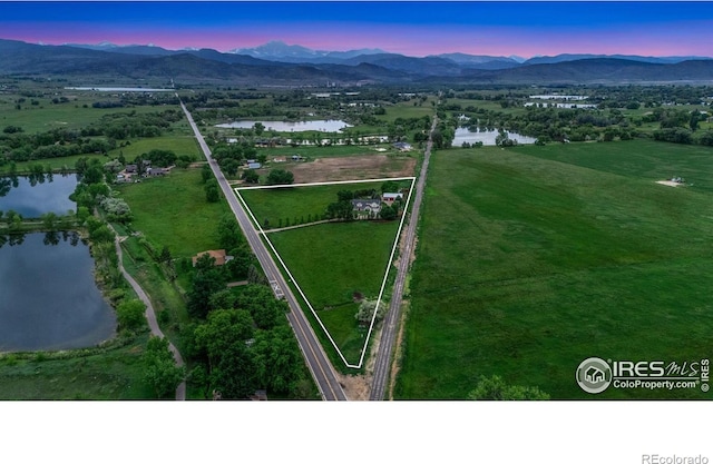 7215 Hygiene Rd, Longmont, CO 80503 - aerial view at dusk of a water and mountain view and property parcel outlined