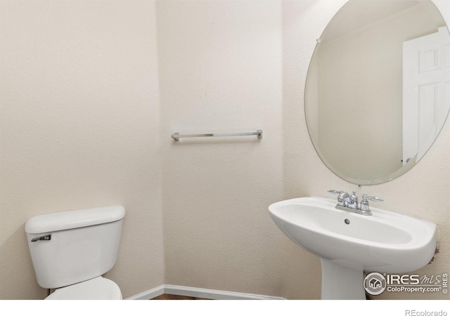3660 W 25th St Unit 1106, Greeley, CO 80634 - half bathroom featuring toilet