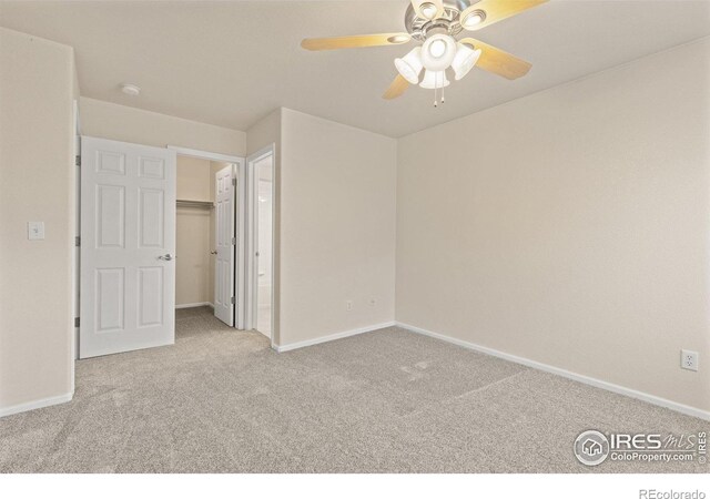 3660 W 25th St Unit 1106, Greeley, CO 80634 - unfurnished bedroom with carpet floors, baseboards, a walk in closet, and a closet