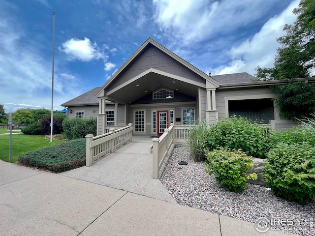 3660 W 25th St Unit 1106, Greeley, CO 80634 - view of front of property featuring covered porch and roof with shingles