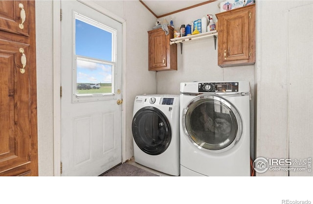 39780 County Road 68, Briggsdale, CO 80611 - laundry area featuring independent washer and dryer, crown molding, and cabinet space