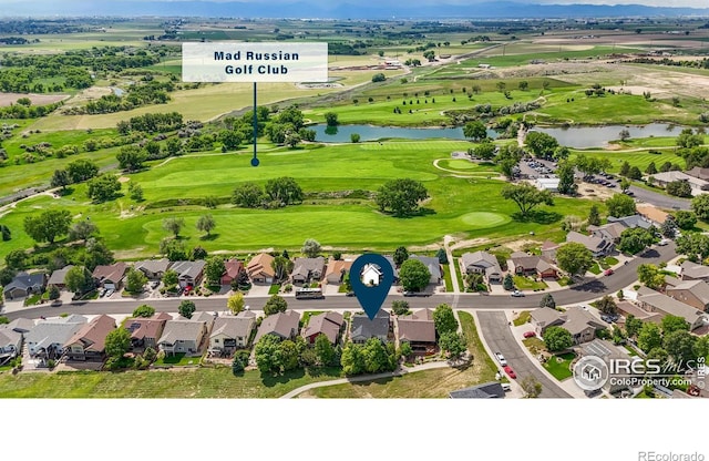 2325 Birdie Way, Milliken, CO 80543 - aerial view of residential area with a nearby body of water and a golf course