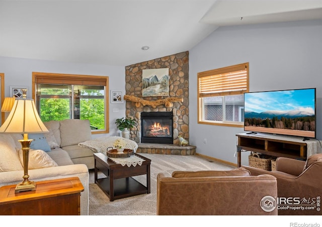 2325 Birdie Way, Milliken, CO 80543 - living area featuring lofted ceiling, a stone fireplace, carpet floors, and baseboards