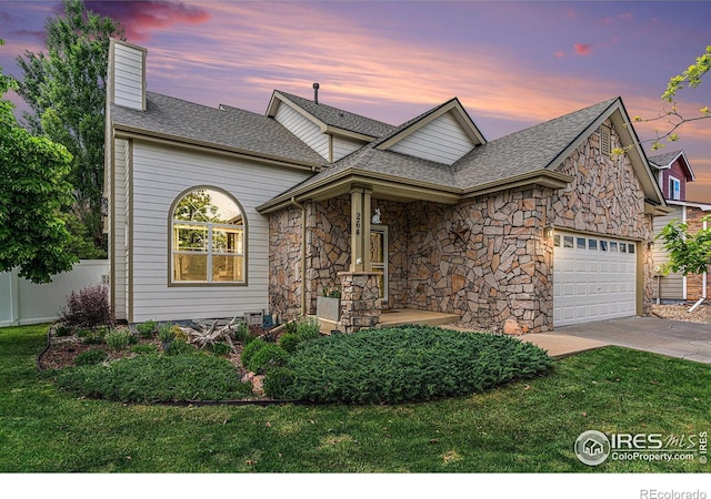 264 Alder Ave, Johnstown, CO 80534 - view of front of house with an attached garage, driveway, a shingled roof, and a chimney