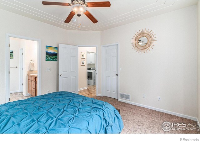 264 Alder Ave, Johnstown, CO 80534 - bedroom with washer / dryer, light carpet, ensuite bathroom, baseboards, and a ceiling fan