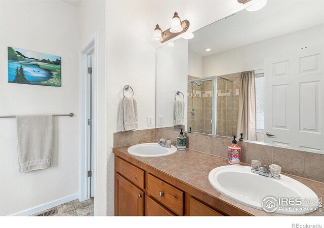264 Alder Ave, Johnstown, CO 80534 - full bathroom featuring a stall shower and double vanity
