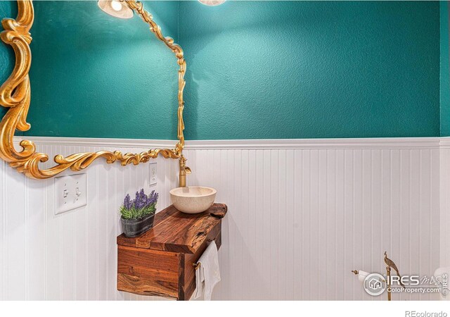 264 Alder Ave, Johnstown, CO 80534 - bathroom featuring wainscoting and a sink
