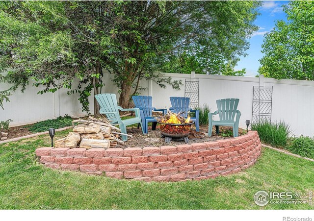 264 Alder Ave, Johnstown, CO 80534 - view of patio / terrace featuring an outdoor fire pit