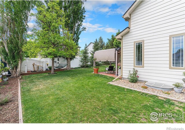264 Alder Ave, Johnstown, CO 80534 - view of yard with a patio