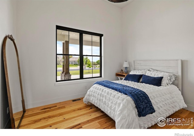 37179 Soaring Eagle Cir, Severance, CO 80550 - bedroom with wood finished floors and baseboards