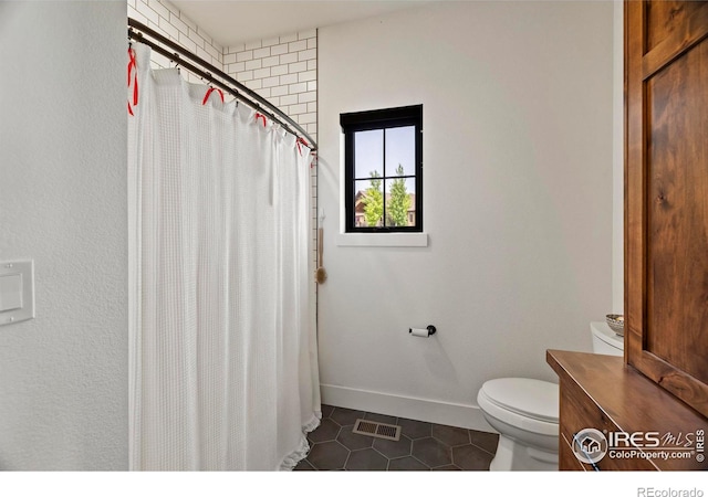 37179 Soaring Eagle Cir, Severance, CO 80550 - full bath with tile patterned floors, toilet, baseboards, a shower with shower curtain, and vanity