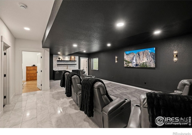 37179 Soaring Eagle Cir, Severance, CO 80550 - cinema room featuring recessed lighting, baseboards, light marble finish floors, and bar area