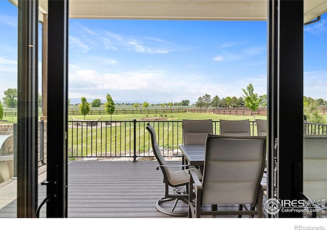 37179 Soaring Eagle Cir, Severance, CO 80550 - wooden deck featuring a lawn and a rural view