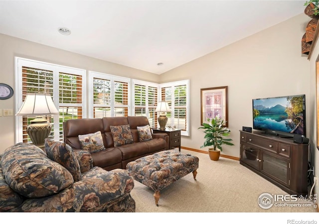 1142 Muirfield Way, Fort Collins, CO 80525 - living area featuring carpet floors, vaulted ceiling, baseboards, and healthy amount of natural light