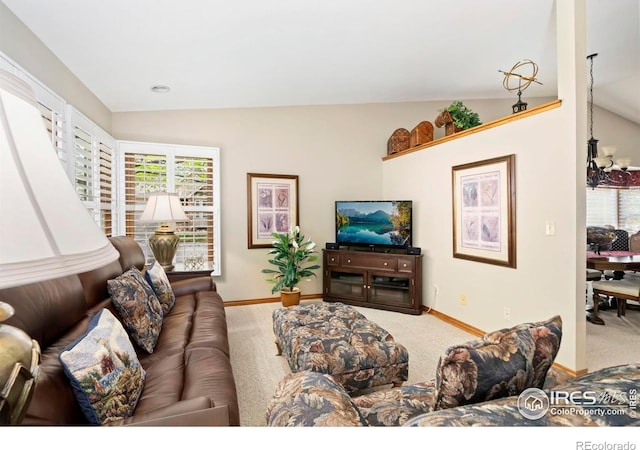 1142 Muirfield Way, Fort Collins, CO 80525 - carpeted living room featuring vaulted ceiling and baseboards