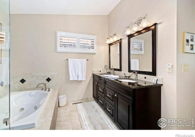1142 Muirfield Way, Fort Collins, CO 80525 - full bathroom with double vanity, a whirlpool tub, tile patterned floors, and baseboards