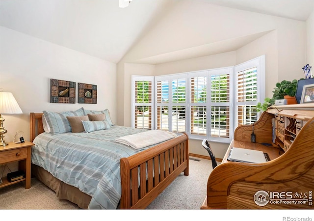 1142 Muirfield Way, Fort Collins, CO 80525 - carpeted bedroom with lofted ceiling and baseboards