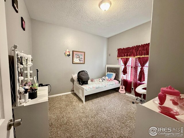 541 S Phelan Ave, Holyoke, CO 80734 - bedroom with a textured ceiling and carpet