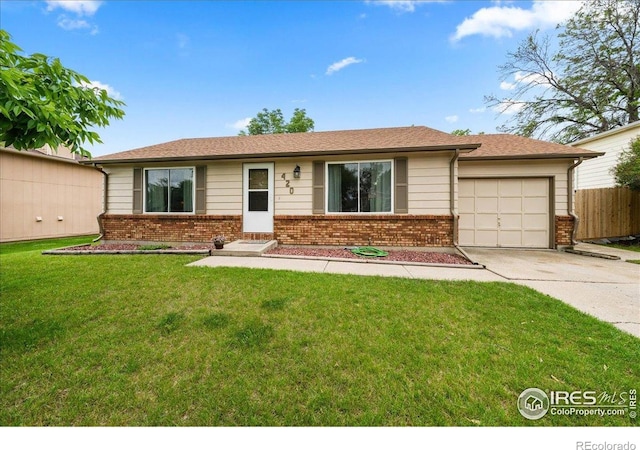 420 E 50th St, Loveland, CO 80538 - single story home featuring concrete driveway, brick siding, and a garage