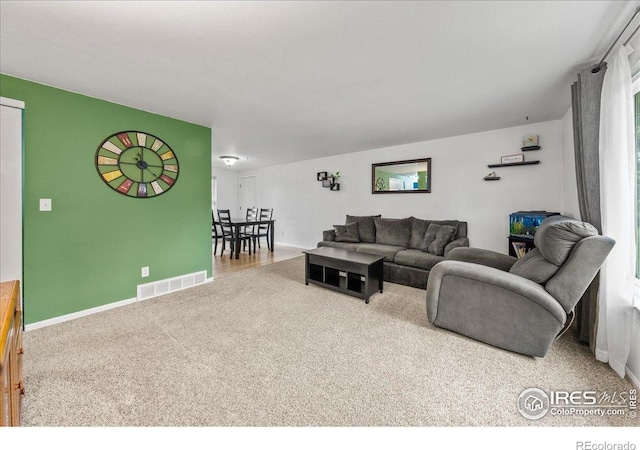 420 E 50th St, Loveland, CO 80538 - carpeted living area featuring baseboards