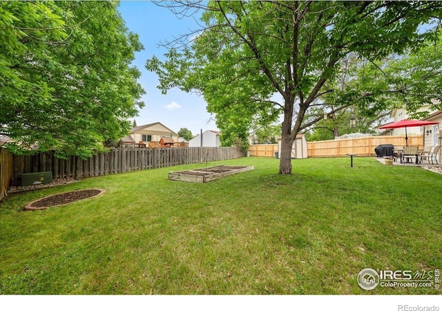 420 E 50th St, Loveland, CO 80538 - view of yard with a garden and a patio area