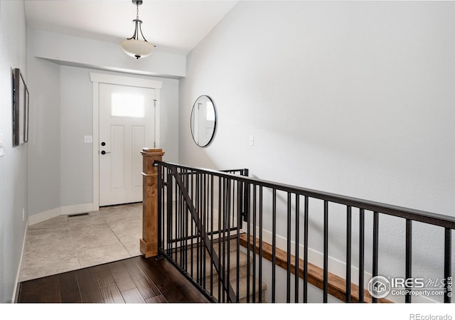 455 Radiant Dr, Loveland, CO 80538 - foyer featuring wood finished floors and baseboards