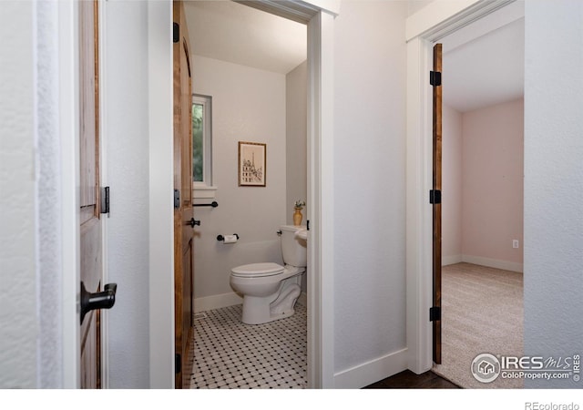 455 Radiant Dr, Loveland, CO 80538 - bathroom with toilet and baseboards
