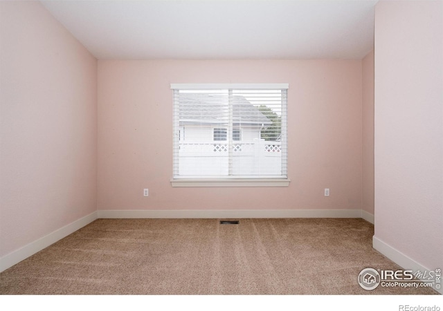 455 Radiant Dr, Loveland, CO 80538 - carpeted spare room with baseboards