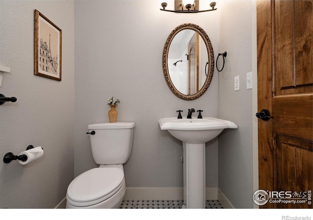 455 Radiant Dr, Loveland, CO 80538 - bathroom with toilet and baseboards