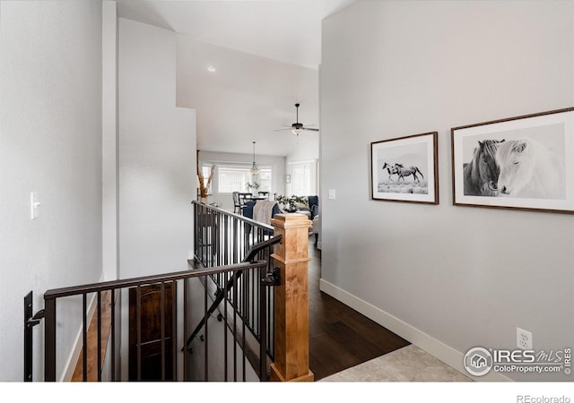 455 Radiant Dr, Loveland, CO 80538 - stairs featuring ceiling fan, baseboards, and wood finished floors