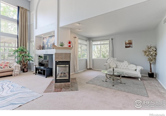 7858 Oban Ct, Lone Tree, CO 80124 - living area featuring carpet flooring, a tile fireplace, and baseboards