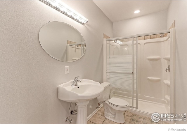 7858 Oban Ct, Lone Tree, CO 80124 - full bath featuring a stall shower, toilet, and tile patterned floors