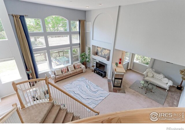 7858 Oban Ct, Lone Tree, CO 80124 - carpeted living room with a fireplace and baseboards