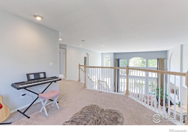 7858 Oban Ct, Lone Tree, CO 80124 - sitting room featuring carpet, recessed lighting, and an upstairs landing