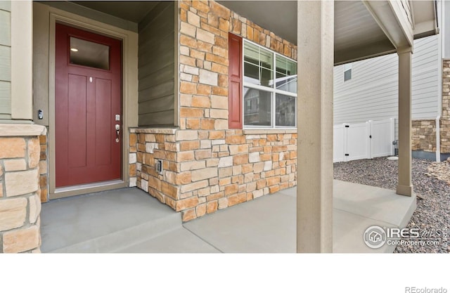 4709 Lynxes Way, Johnstown, CO 80534 - entrance to property with stone siding and a porch