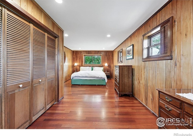 1484 Wicklow St, Boulder, CO 80303 - bedroom featuring wood walls, wood finished floors, a closet, and recessed lighting