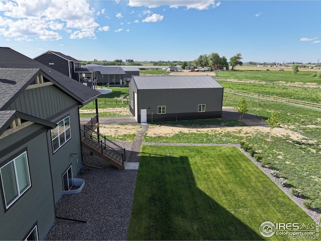 5016 Prairie Lark Ln, Severance, CO 80615 - view of yard featuring an outbuilding, stairs, an outdoor structure, and a view of rural / pastoral area