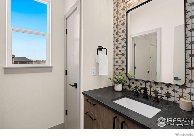 5016 Prairie Lark Ln, Severance, CO 80615 - bathroom with vanity and tasteful backsplash