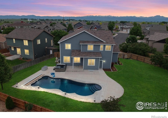 13598 Horseshoe Cir, Mead, CO 80542 - back of house featuring a mountain view, a residential view, and a patio area
