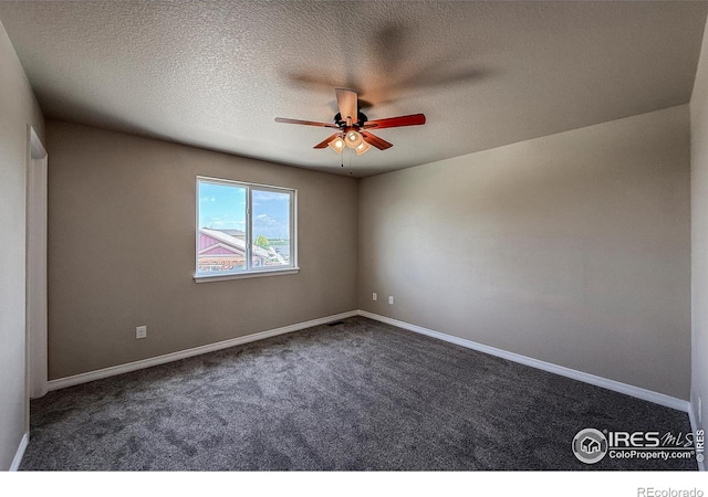 13598 Horseshoe Cir, Mead, CO 80542 - unfurnished room featuring ceiling fan, dark colored carpet, baseboards, and a textured ceiling