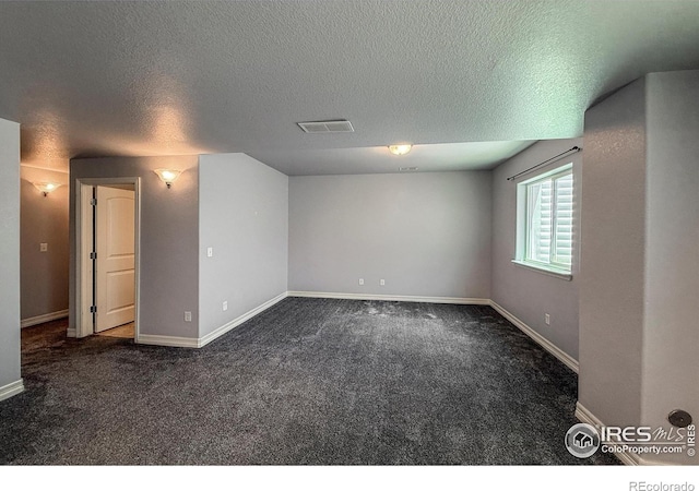 13598 Horseshoe Cir, Mead, CO 80542 - carpeted empty room with a textured ceiling and baseboards