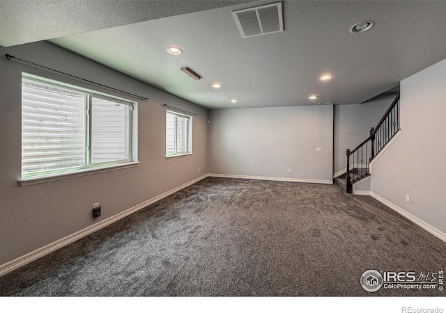 13598 Horseshoe Cir, Mead, CO 80542 - carpeted empty room featuring recessed lighting, a textured ceiling, baseboards, and stairs