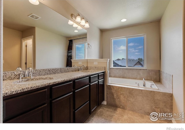 13598 Horseshoe Cir, Mead, CO 80542 - full bathroom featuring double vanity, a bath, and tile patterned floors