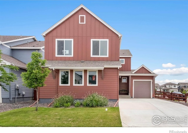 2031 Moon Rise Dr, Windsor, CO 80550 - view of front of home featuring board and batten siding, driveway, a garage, and a front yard